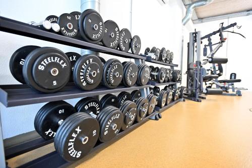 a row of dumbbells on display in a gym at Hotel Eger & Park in Eger