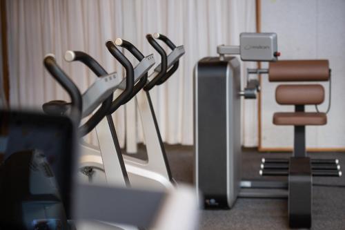 a group of exercise equipment in a room at Dorint Thermenhotel Freiburg in Freiburg im Breisgau