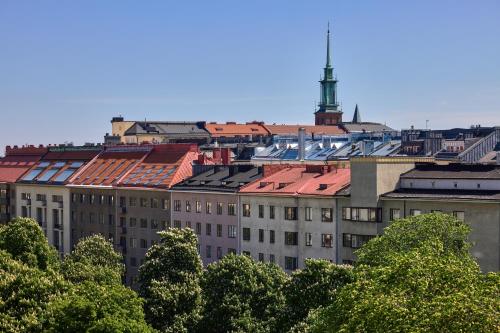 a group of buildings with trees in the foreground at Töölö Towers in Helsinki