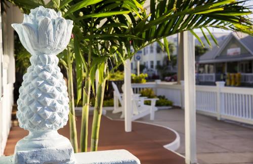a white vase sitting on top of a porch at Southwinds Motel in Key West