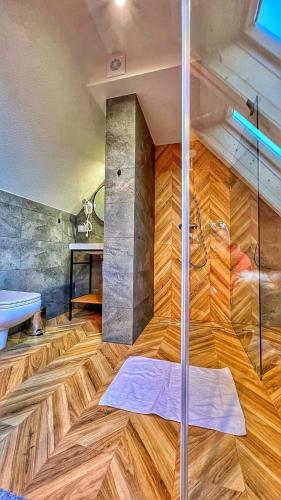 a bathroom with a shower with a glass door at Maryna Bór in Zakopane