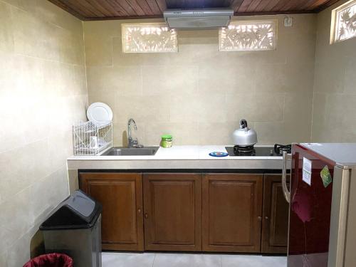 a kitchen with a sink and a counter top at Villa Agung Khalia Ubud in Ubud