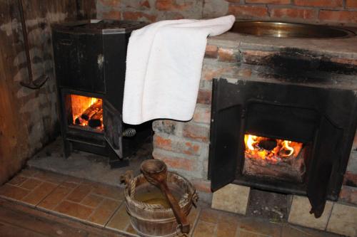 a brick oven with a towel on top of it at Landhouse in Olofström