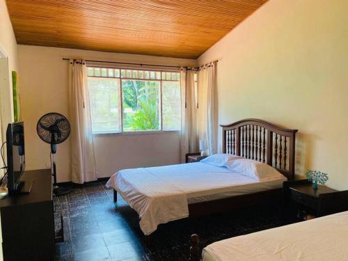 Voodi või voodid majutusasutuse Agradable finca campestre familiar con piscina toas