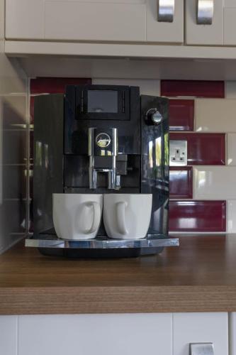 a coffee maker sitting on a counter in a kitchen at Hill Top in Bradford
