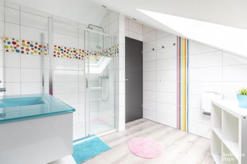 a bathroom with a shower and a sink at Ô Gris Cottage in Durbuy