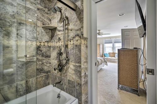 a bathroom with a shower and a bath tub at Ventnor City Retreat about 1 Block To Boardwalk! in Ventnor City