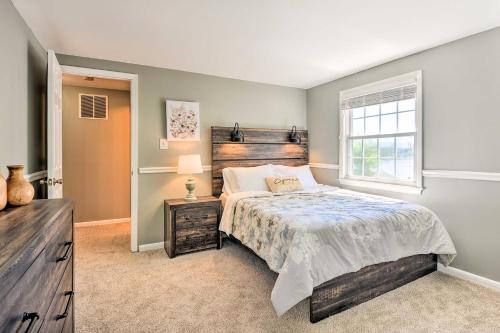 a bedroom with a bed and a window at Sunny Glen Burnie Home - On-Site Water Access in Glen Burnie