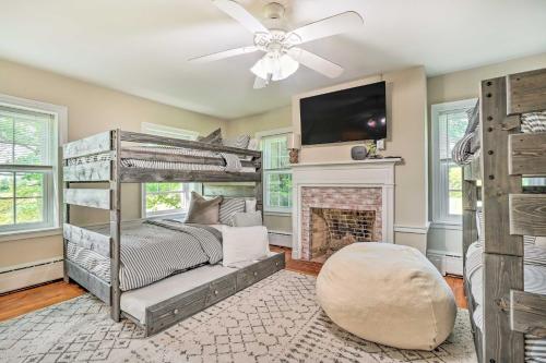 a bedroom with a bunk bed and a fireplace at Upscale Country Home with Fire Pit in Taneytown! in Taneytown