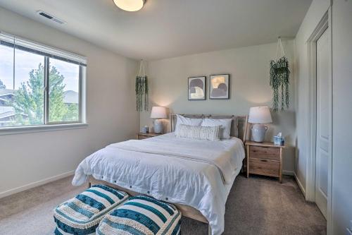 a bedroom with a bed and a window at Serene Bend Getaway with Hot Tub and Fire Pit! in Bend