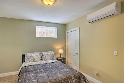 a bedroom with a bed and a ceiling fan at Cozy Cleveland Apartment about 2 Mi to Downtown! in Cleveland