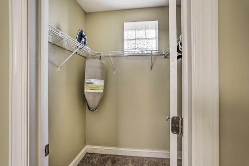 a walk in shower in a bathroom next to a window at Cozy Cleveland Apartment about 2 Mi to Downtown! in Cleveland