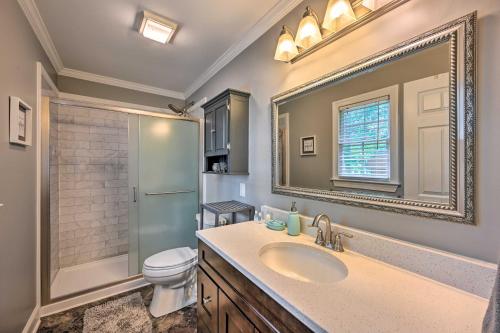 a bathroom with a sink and a toilet and a mirror at Peaceful Country Retreat with Easy Highway Access! in Monticello