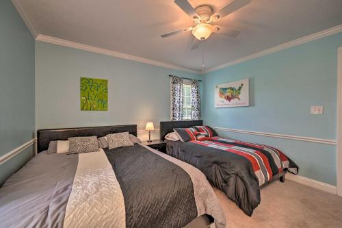 a bedroom with two beds and a ceiling fan at Peaceful Country Retreat with Easy Highway Access! in Monticello