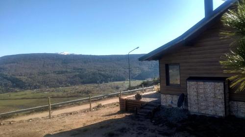 a house with a view of a mountain at La Casa del Viento in San Martín de los Andes