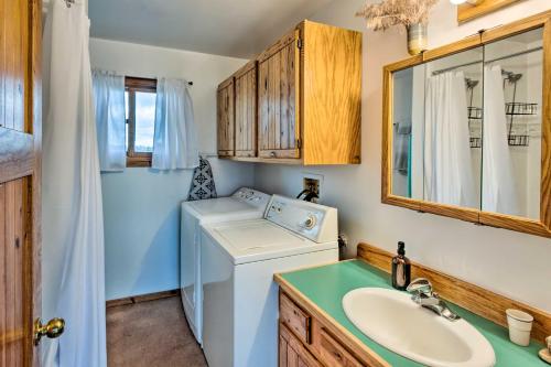 a bathroom with a washing machine and a sink at El Prado Duplex with Deck and Grill - 4 Mi to Town! in El Prado