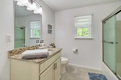 a bathroom with a sink and a toilet at Gorgeous Pocono Summit Retreat with Game Room! in Pocono Summit