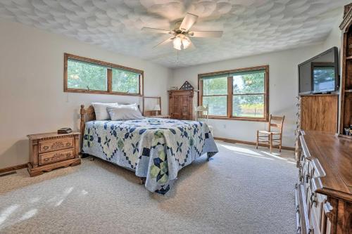 a bedroom with a bed and a ceiling fan at Sturgis Home with Yard Less Than 1 Mi to Minnewaukan Lake in Sturgis
