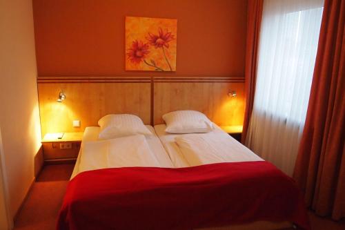 Letto o letti in una camera di Hotel Imperial
