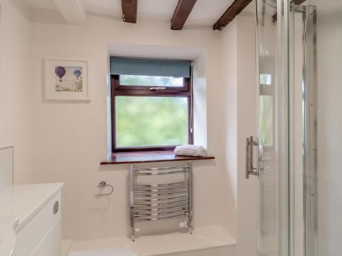 a bathroom with a shower and a window at Canal View House - Uk39363 in Swafield