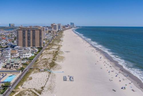 an aerial view of a beach with buildings and the ocean at Gammys Beach Bungalow in Ventnor City