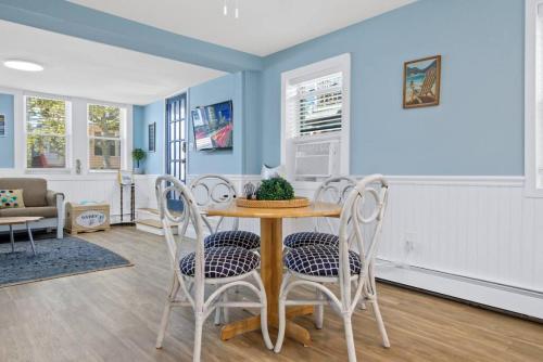 a dining room with a table and chairs at Gammys Beach Bungalow in Ventnor City