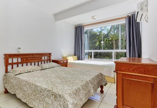 Postel nebo postele na pokoji v ubytování 819 Solar das Bromélias 350 M da Praia Bombinhas Centro