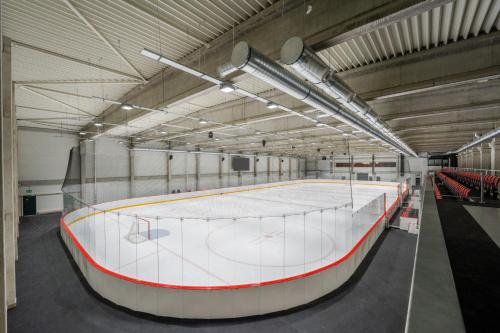a large hockey rink in a large building at Kapka resort in Vsetín