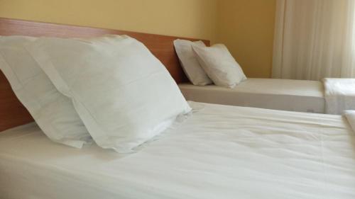 Ένα ή περισσότερα κρεβάτια σε δωμάτιο στο Elit Hotel