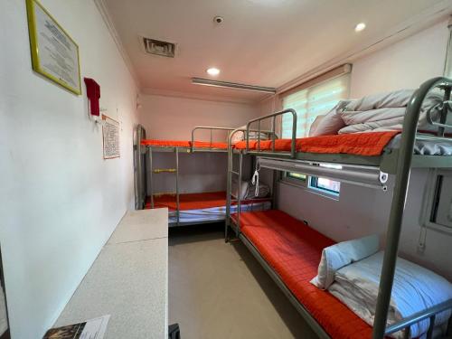 a room with two bunk beds in a train at Hostel Korea - Original in Seoul