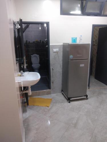 a bathroom with a sink and a shower and a toilet at لبلازا la plaza in Laayoune