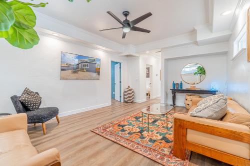 a living room with a couch and a ceiling fan at Stylish 2-Bedroom walking distance to Downtown in Reno