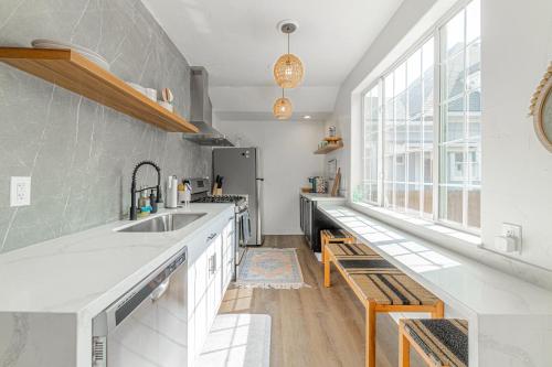 a kitchen with a sink and a large window at Stylish 2-Bedroom walking distance to Downtown in Reno
