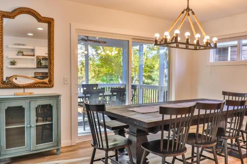 a dining room with a table and chairs and a mirror at Lost Lake Lodge in Nisswa