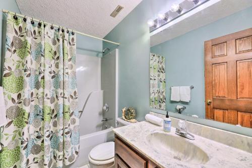 a bathroom with a sink and a shower curtain at Charming Williamstown Retreat with Private Yard in Williamstown