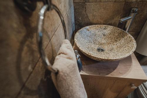 a bathroom with a sink and a counter at The Downtown Nest in Cluj-Napoca