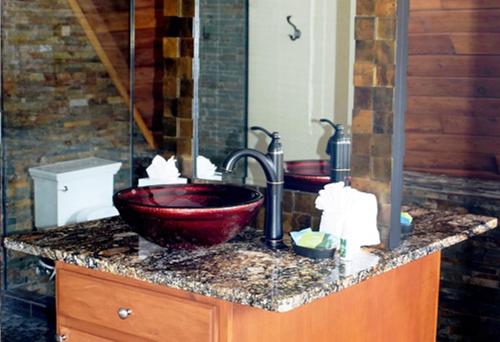 a bathroom with two sinks and two faucets at Beautiful Views Of Mt Quandary Off Private Balcony in Breckenridge
