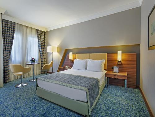 Postel nebo postele na pokoji v ubytování Spa Hotel Colossae Thermal
