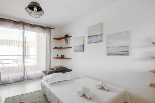 Postel nebo postele na pokoji v ubytování Appartement Vanneau - Welkeys