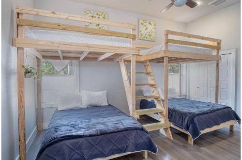 a bedroom with two bunk beds and a ladder at Gorgeous Family-Friendly Home Near Downtown in San Antonio