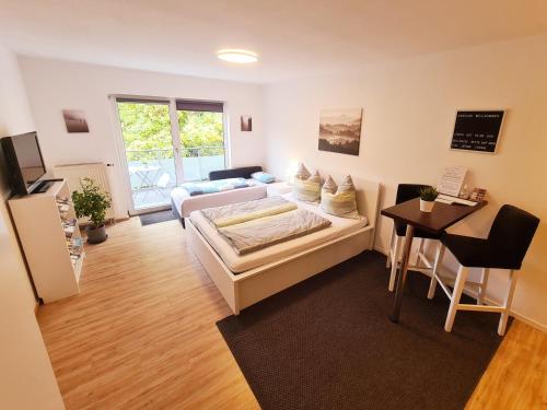 a living room with a couch and a table at Apartment am Gradierbau Bad Kissingen in Bad Kissingen