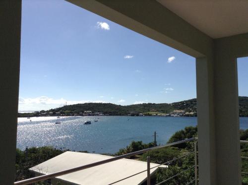 a view of the water from the balcony of a house at Villa Ensenada Honda in Culebra