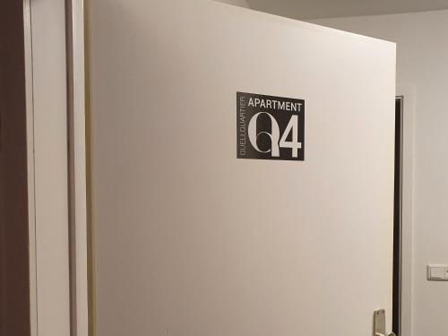 a sign on the side of a door with a percent sign at QUELLQUARTIER in Fulda