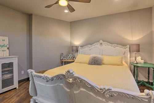 a bedroom with a white bed and a ceiling fan at Black Hills Retreat about 3 Mi to ATV Trails! in Piedmont