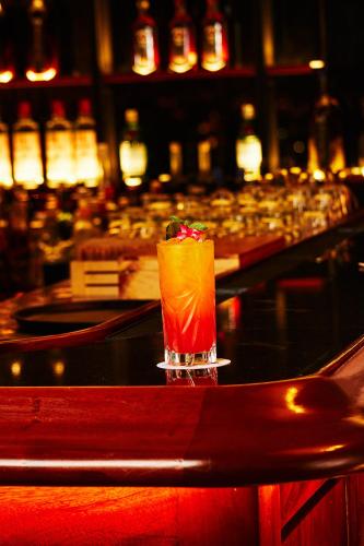a drink sitting on top of a bar at Hotel Estelar Miraflores in Lima