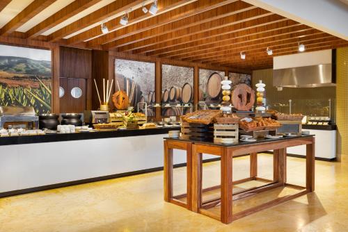 a bakery with a buffet of pastries on display at Villa La Valencia Beach Resort & Spa Los Cabos in San José del Cabo