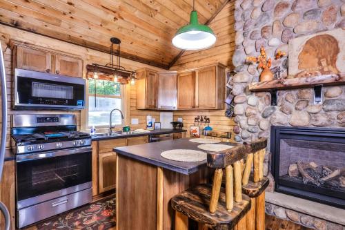 a kitchen with a stove and a fireplace at The Nut House in Eagle River
