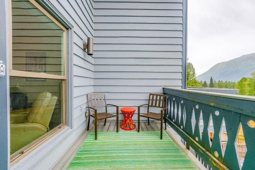 a porch with two chairs and a table at Mountainside Condo #307 in Girdwood