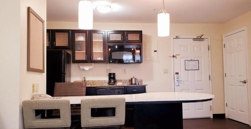 a kitchen with a white counter top in a room at Candlewood Suites Houston Medical Center by IHG in Houston