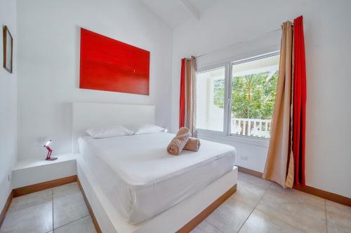 Ένα ή περισσότερα κρεβάτια σε δωμάτιο στο Villa Casa Azul & Arena Blanca Apartamentos